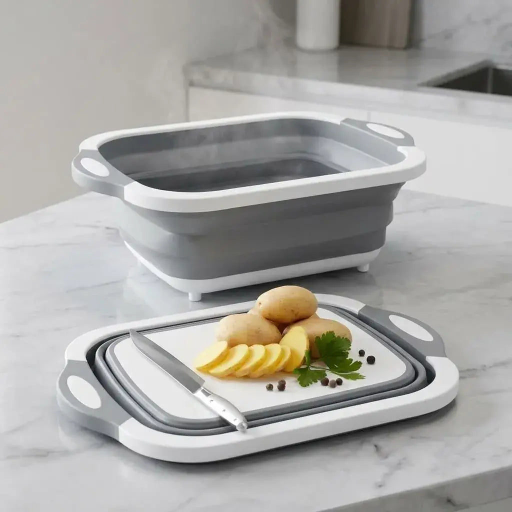 Tabla multiuso 4 en 1 plegable para cocina con colador, escurridor y tabla de corte. Ideal para lavar frutas, verduras y organizar utensilios.