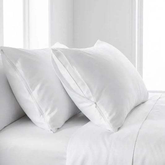 Set de dos almohadas siliconadas con relleno suave de algodón siliconado y funda con cremallera. Confort y soporte para un mejor descanso.