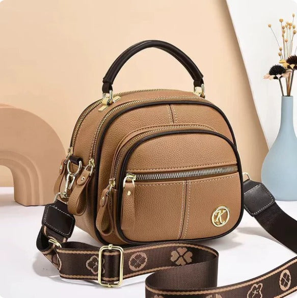 Bolso bandolera premium en sintético tipo cuero con cremallera y correa ajustable. Elegante, práctico e ideal para uso diario en Colombia.