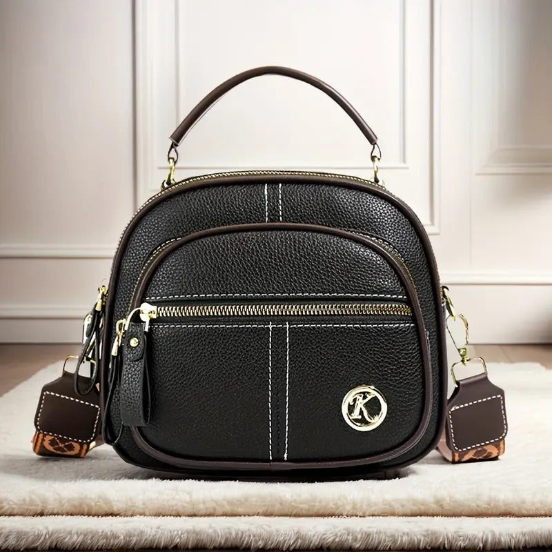 Bolso bandolera premium en sintético tipo cuero con cremallera y correa ajustable. Elegante, práctico e ideal para uso diario en Colombia.