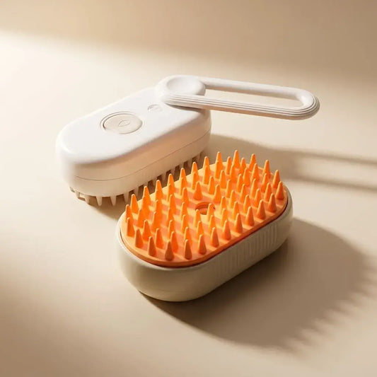 Cepillo Vaporizador para mascotas con cerdas suaves y función de masaje. Ideal para perros y gatos, ayuda a retirar pelo suelto, desenredar y facilitar el cuidado del pelaje.