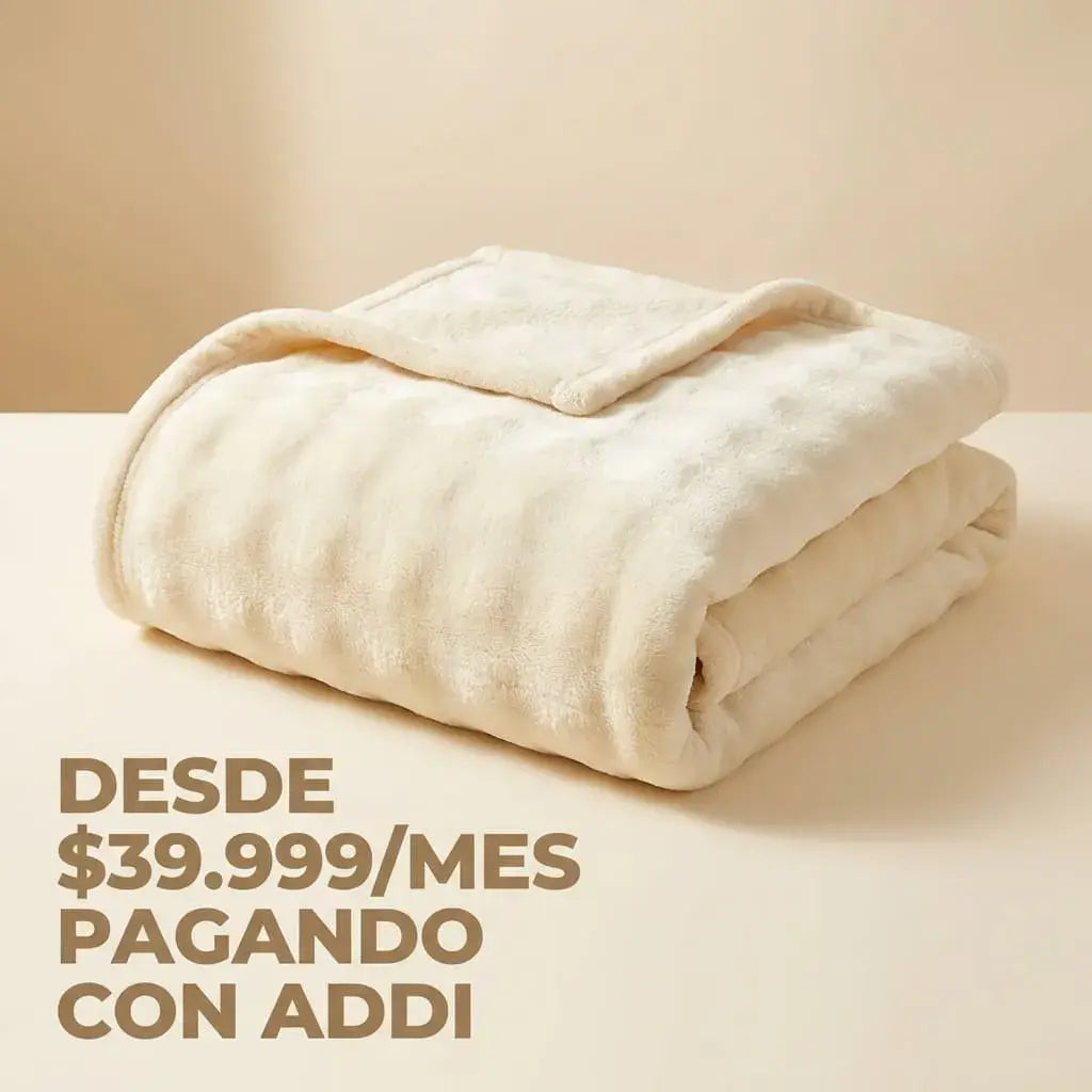 Cobija suave tipo piel de conejo con textura piña, térmica y confortable, ideal para un descanso cálido y acogedor.