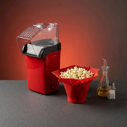 Combo de crispetera eléctrica con aire caliente y taza plegable de silicona para microondas. Ideal para preparar palomitas frescas en casa.