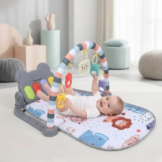 Gimnasio musical para bebé con piano de pedal y juguetes colgantes desmontables. Estimula el desarrollo motor, sensorial y la coordinación desde la primera infancia.