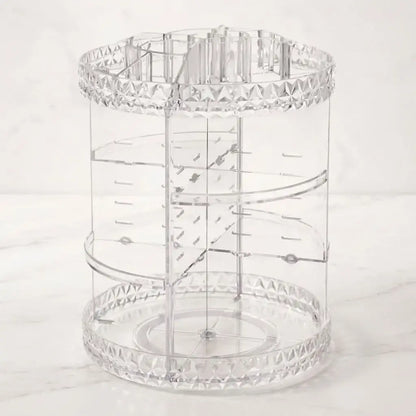 Organizador de maquillaje giratorio 360° en acrílico tipo diamante, con estantes ajustables y amplio espacio para cosméticos, perfumes y joyas.
