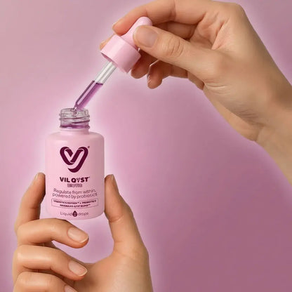 Gotas probióticas con ingredientes naturales que apoyan el equilibrio hormonal femenino y el bienestar del ciclo menstrual.