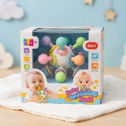 Sonajero mordedor sensorial para bebé desde 3 meses, con silicona texturizada, colores llamativos y sonido suave para acompañar la dentición y el juego sensorial.