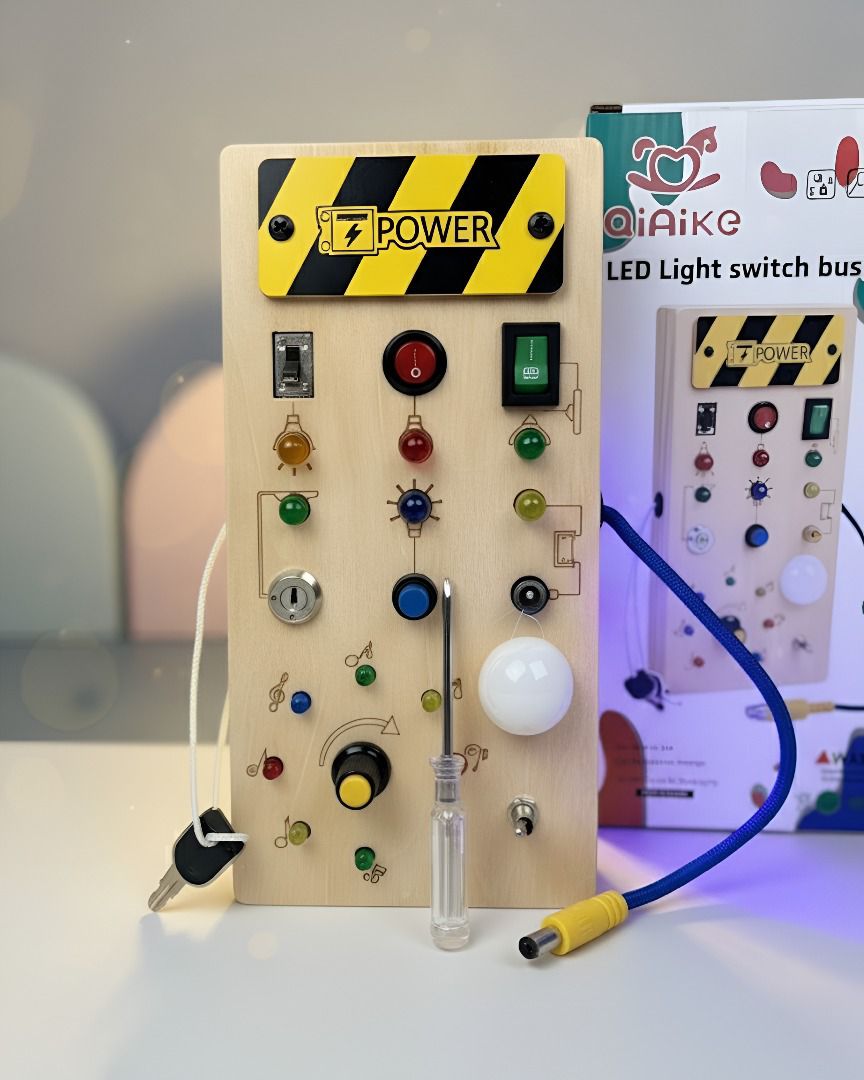 Tablero sensorial Montessori con 8 interruptores y luces LED. Juguete educativo que desarrolla motricidad fina, concentración y habilidades cognitivas en niños.