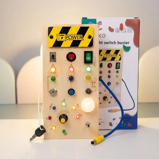 Tablero sensorial Montessori con 8 interruptores y luces LED. Juguete educativo que desarrolla motricidad fina, concentración y habilidades cognitivas en niños.