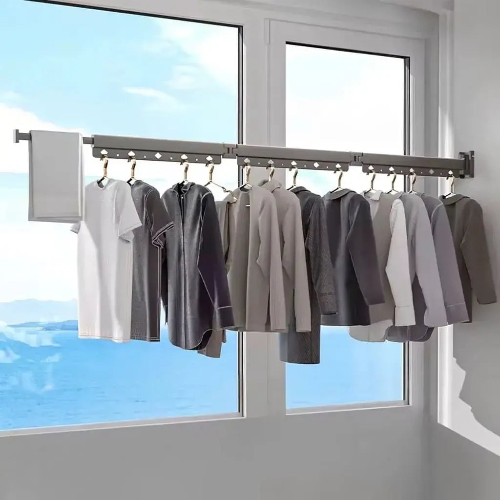 Tendedero plegable retráctil de 3 barras para secar ropa y aprovechar mejor espacios pequeños. Práctico para lavanderías, balcones y apartamentos.